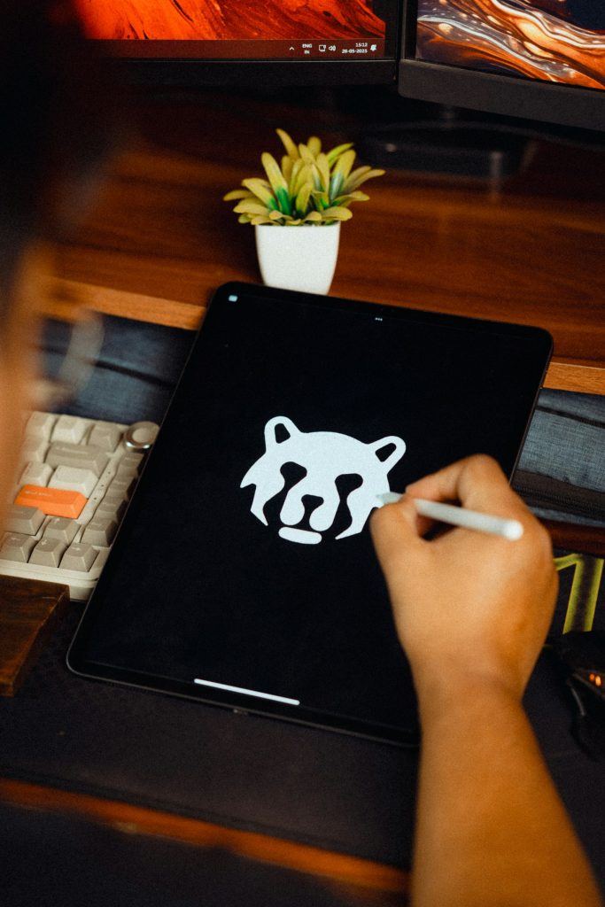 Designer drawing a logo on a graphics tablet
