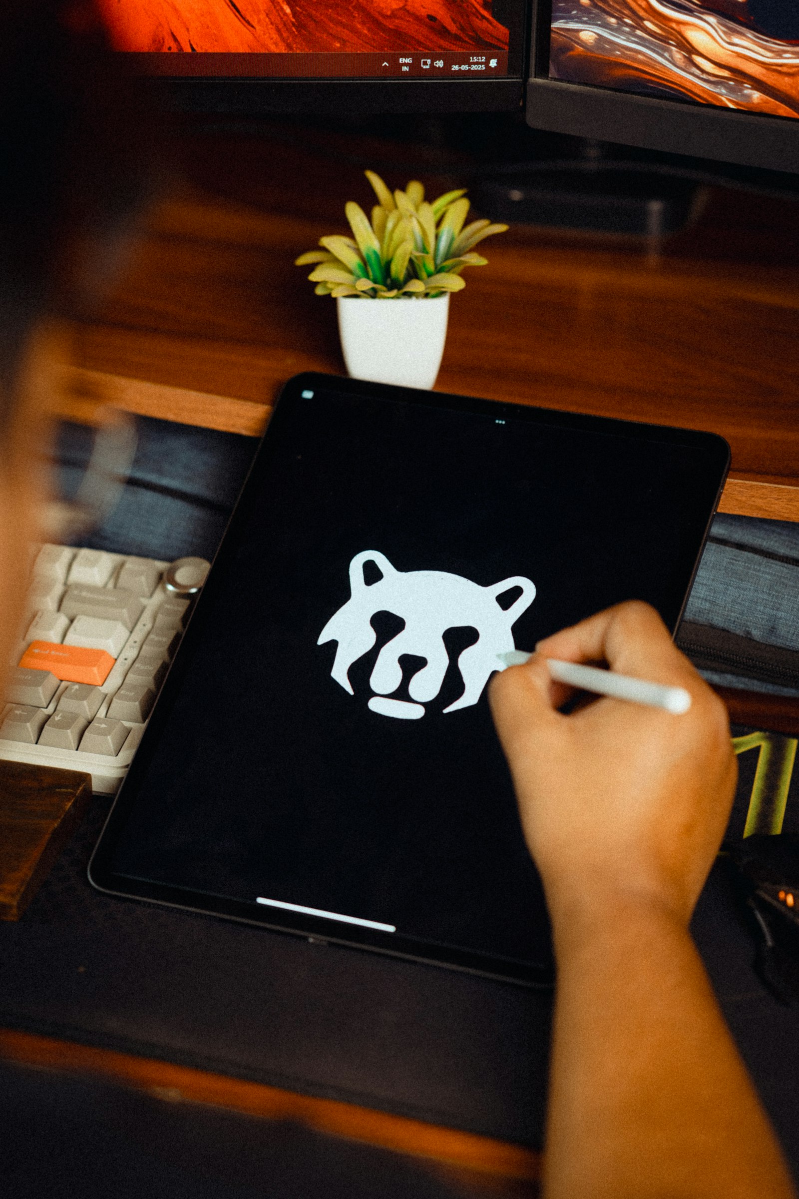 Designer drawing a logo on a graphics tablet