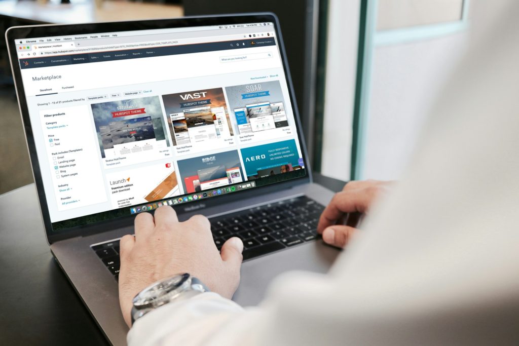 Person using a laptop to design a website