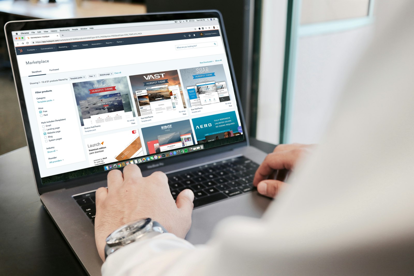 Person using a laptop to design a website