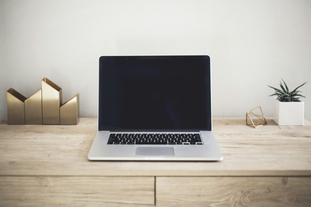 Laptop set up for writing on a table